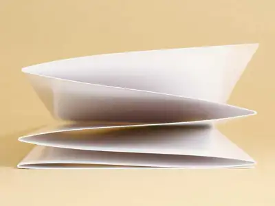 With conventional creasing, folded cardboard always tends to stand up or even split open