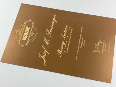 Award printed on simsa MetalPaper gold cardboard