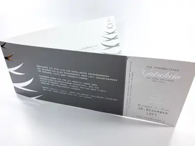 Event invitation with silver hot foil stamping and perforated coupon tear-off