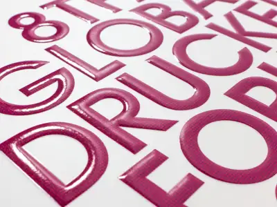 UV coating and embossing with rounded, bulging letters